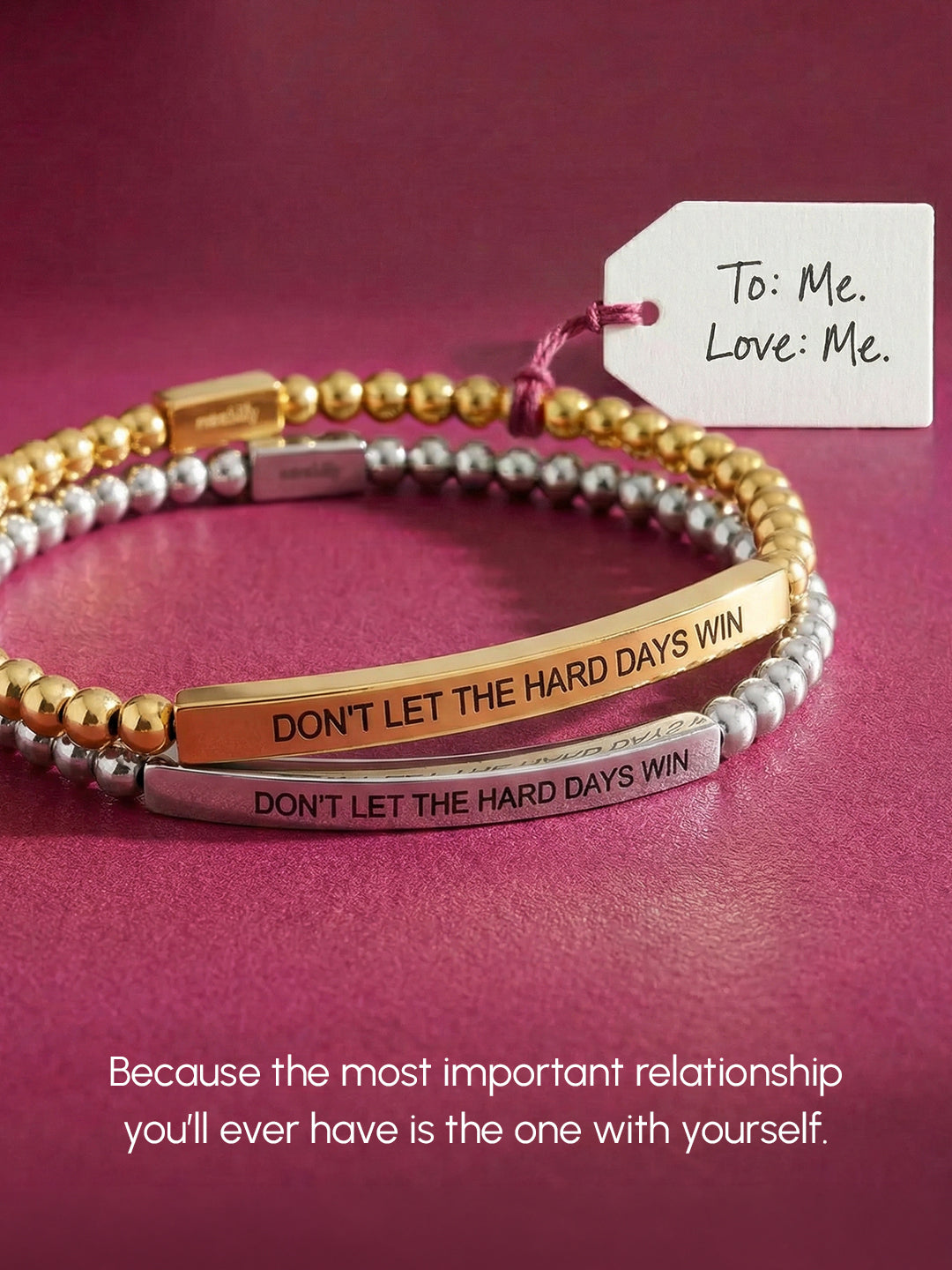 Two beaded bracelets with motivational message on a pink background