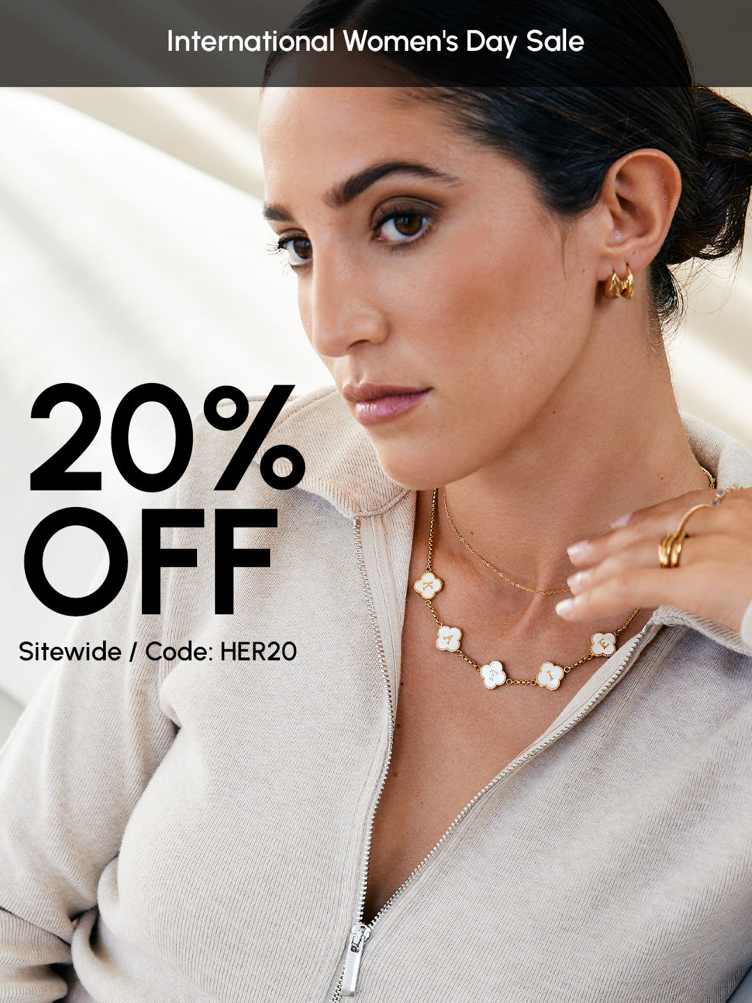 Woman wearing jewelry with '20% OFF' promotion text on a beige background