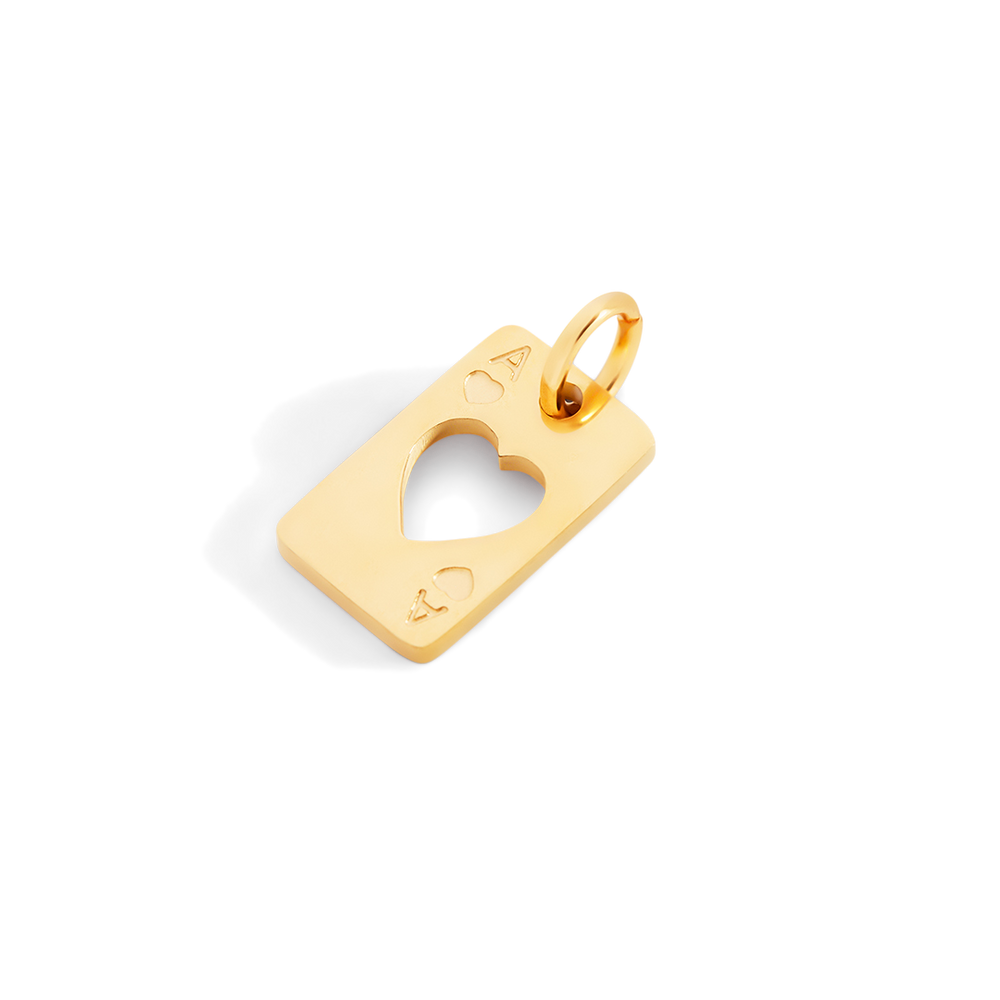 Gold pendant with a heart cutout on a light gray background