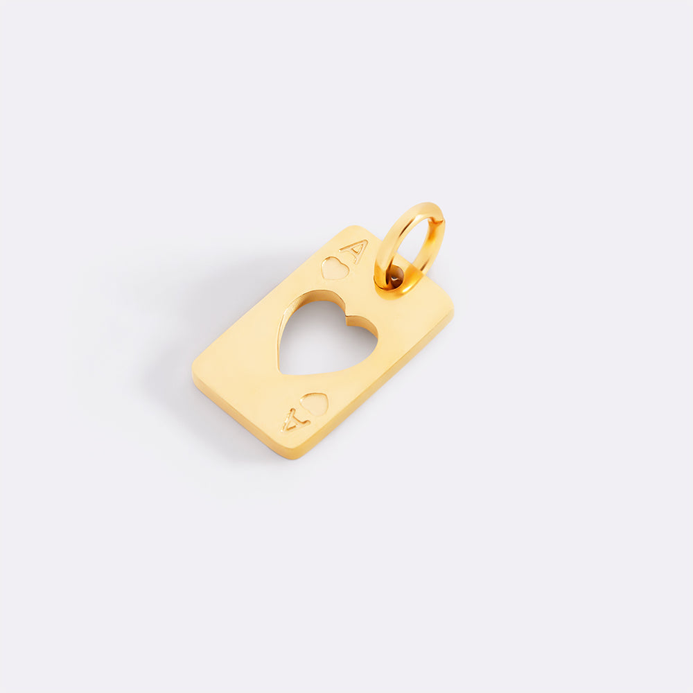 Gold pendant with a heart cutout on a light gray background