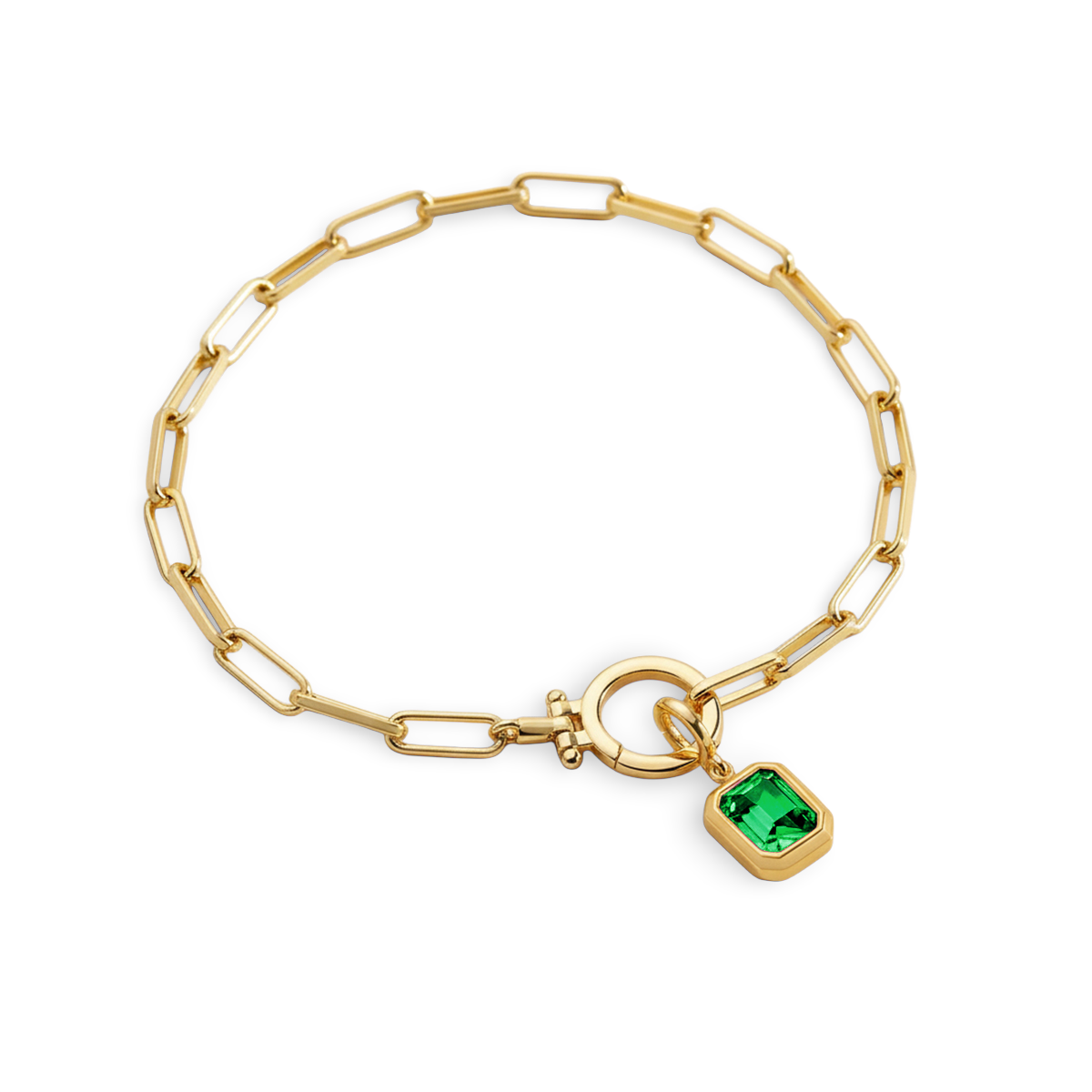 Gold bracelet with a green gemstone charm on a white background