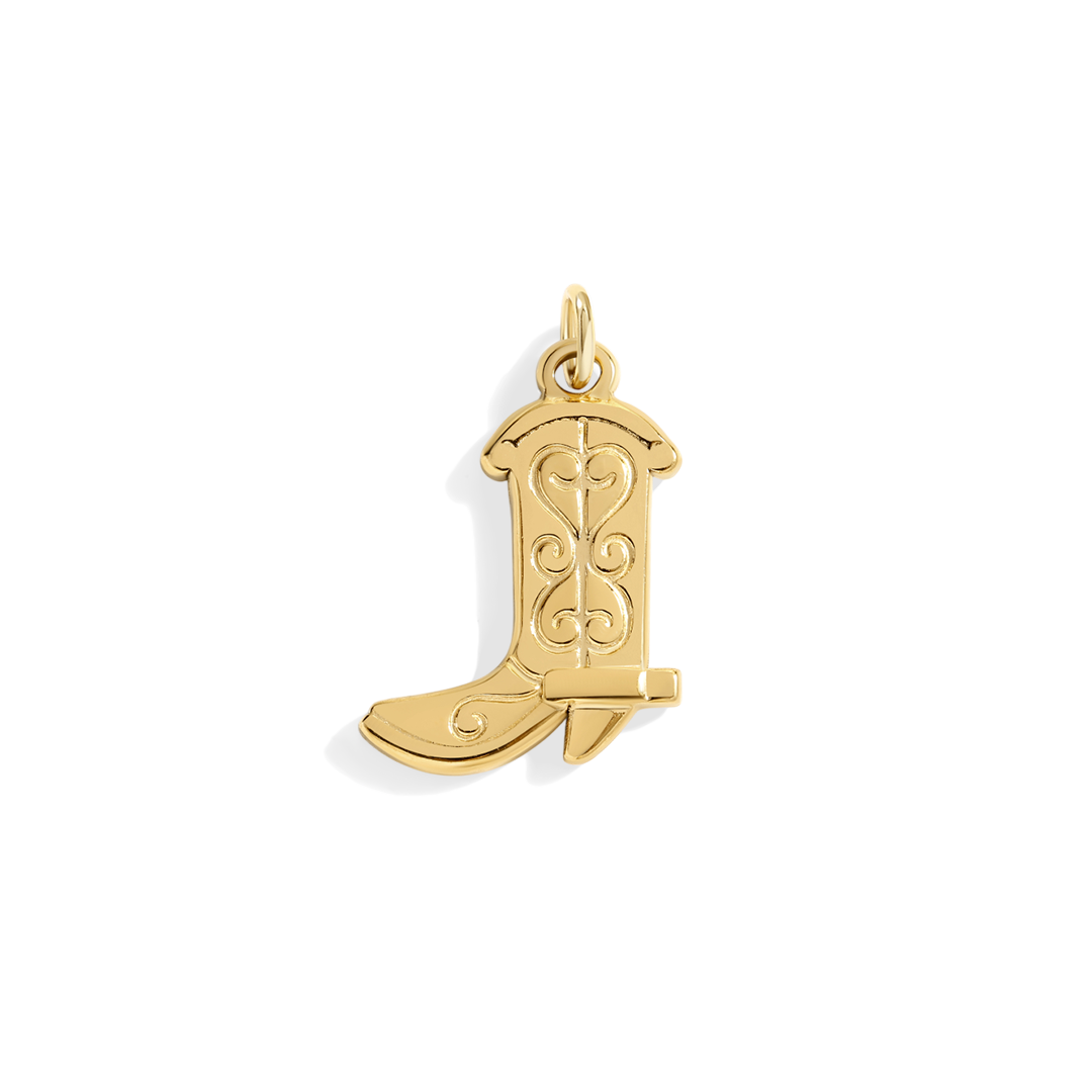 Gold cowboy boot pendant on a white background