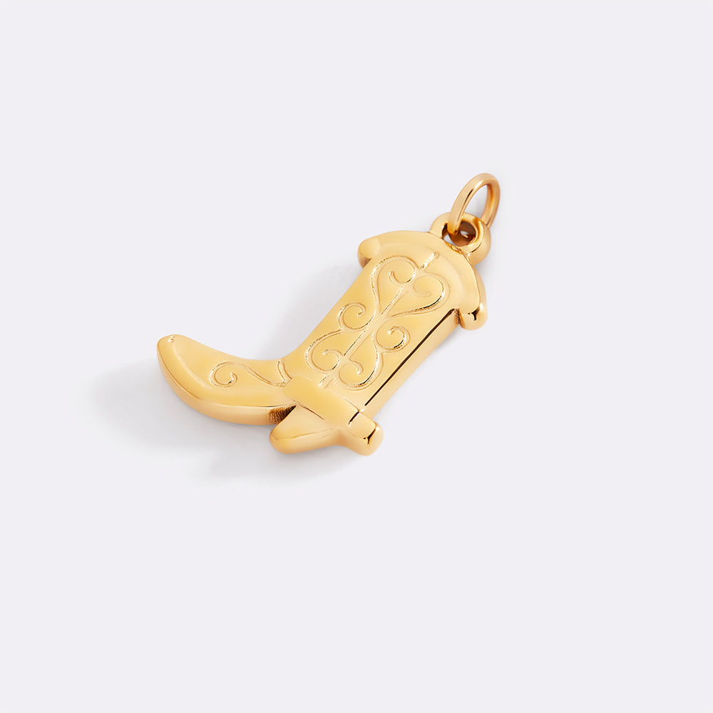 Gold cowboy boot pendant on a light gray background