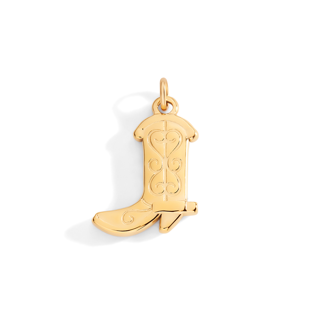 Gold cowboy boot pendant on a light gray background