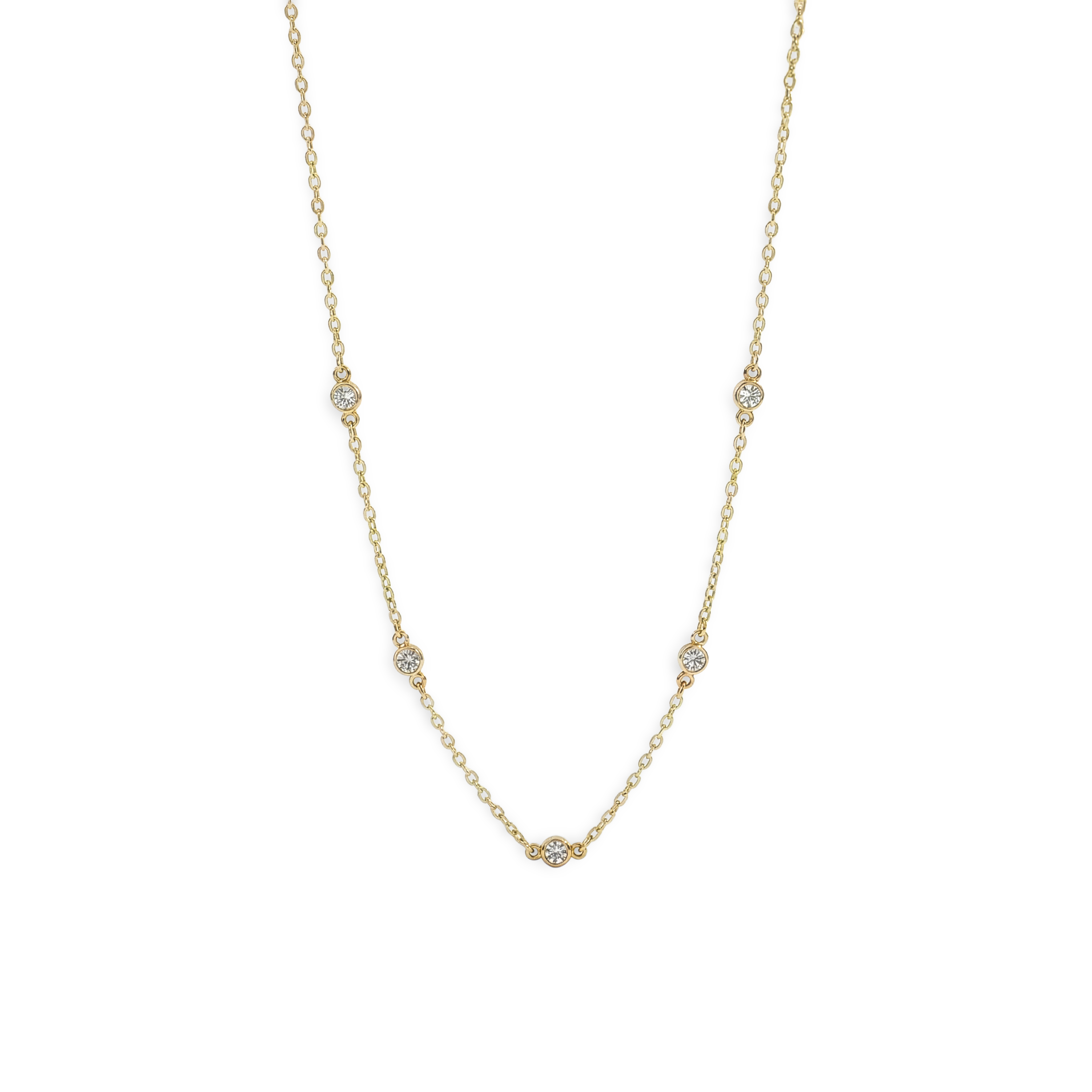 Gold necklace with small diamonds on a white background