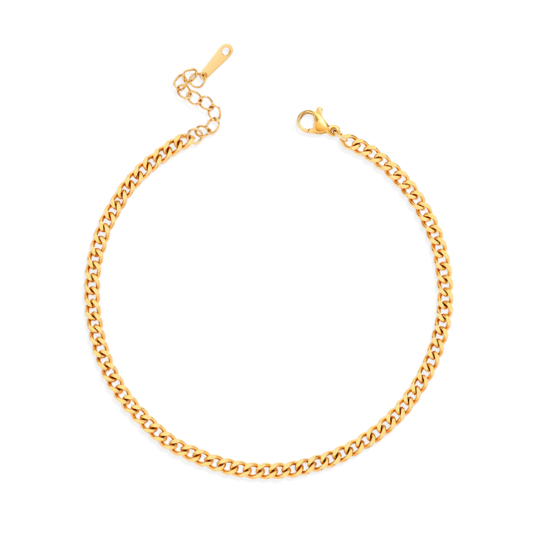 A gold curb chain anklet on a white background.