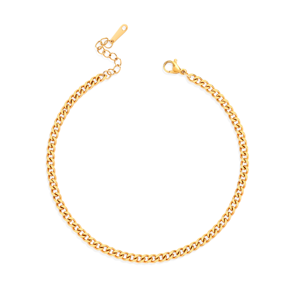 A gold curb chain anklet on a white background.