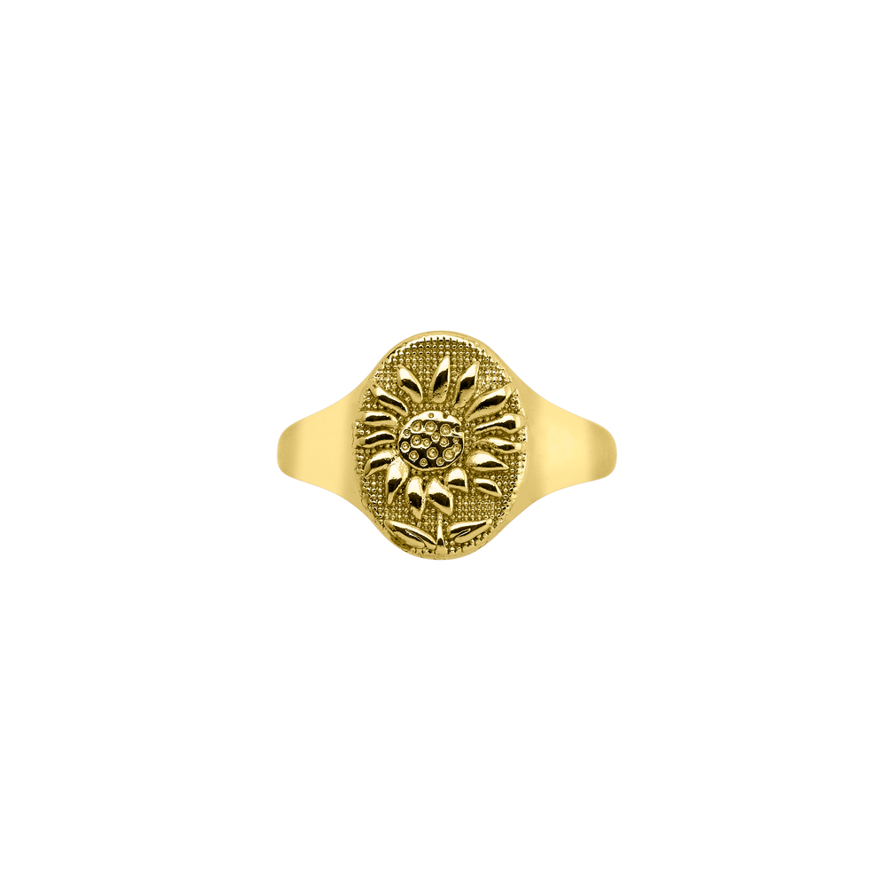 A gold-colored ring with a sunflower design