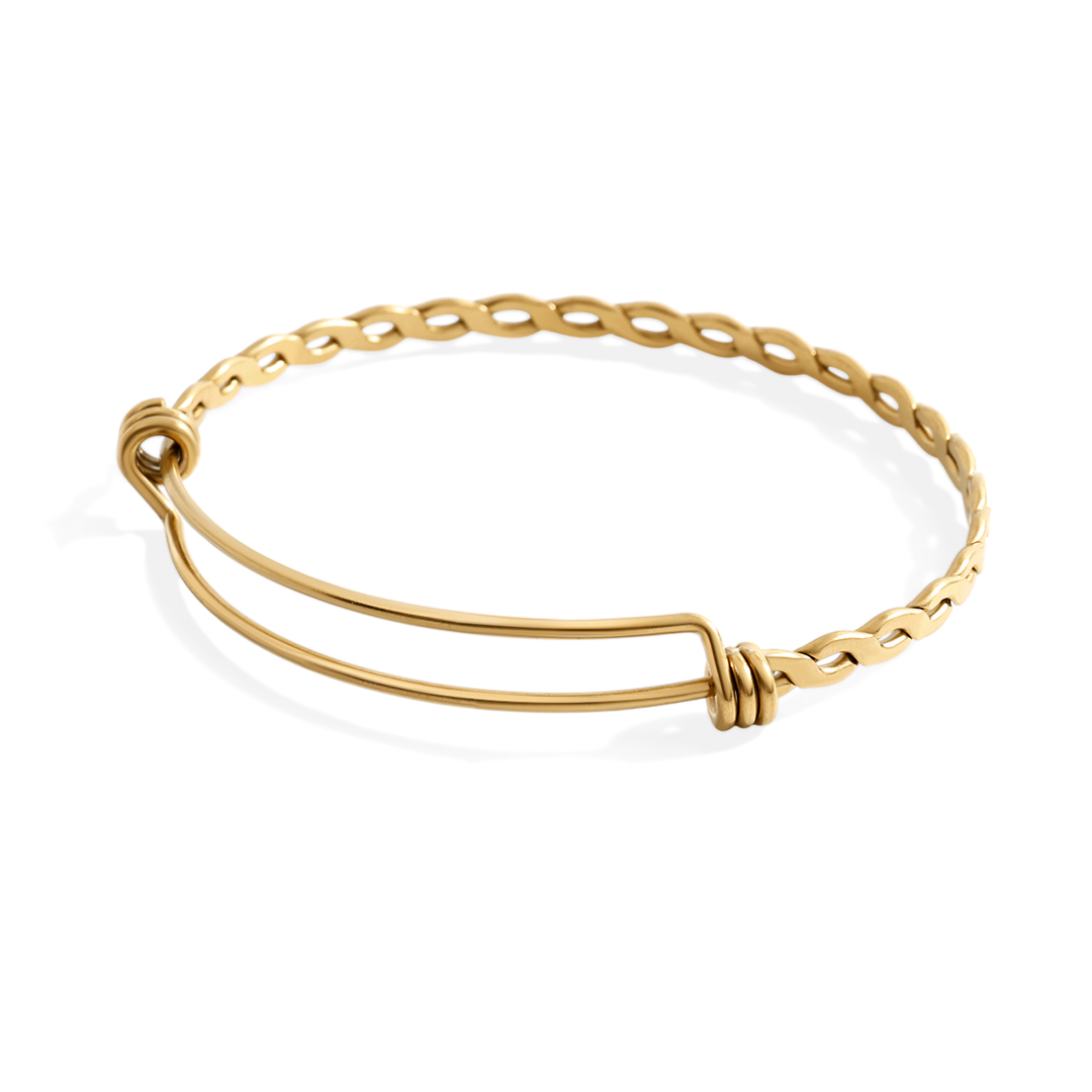 Gold bracelet on a light gray background