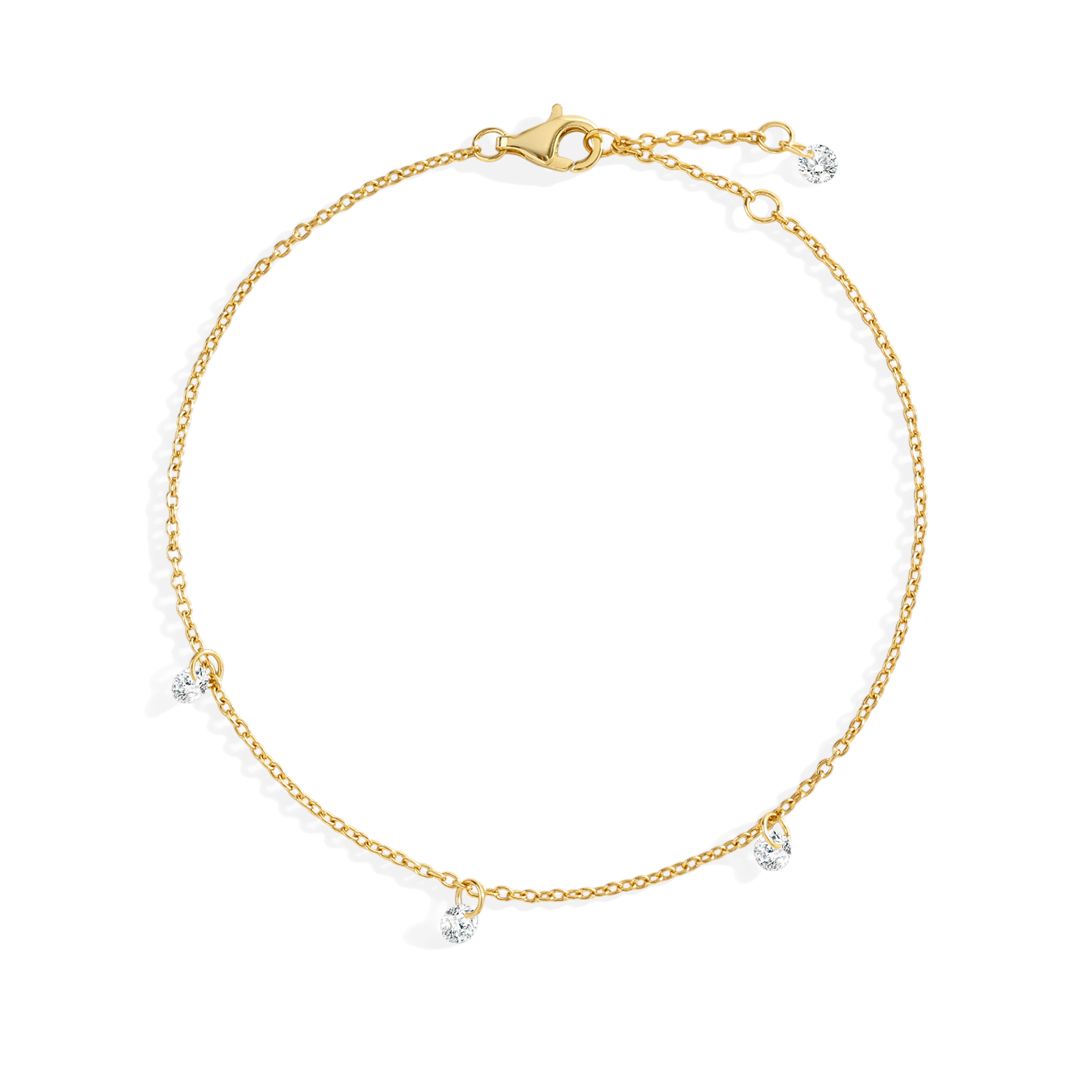 Gold bracelet with small diamonds on a white background