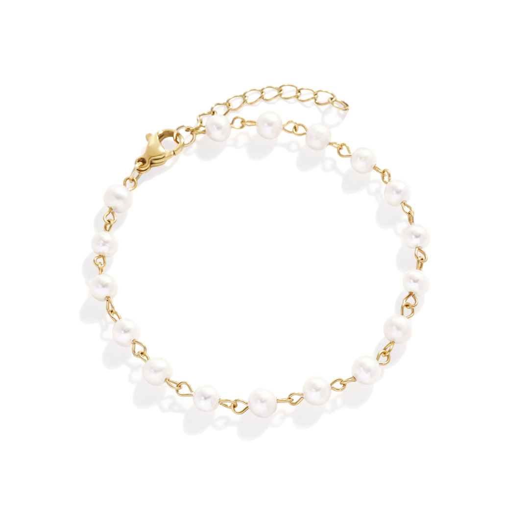 Bracelet with white beads and gold chain on a white background