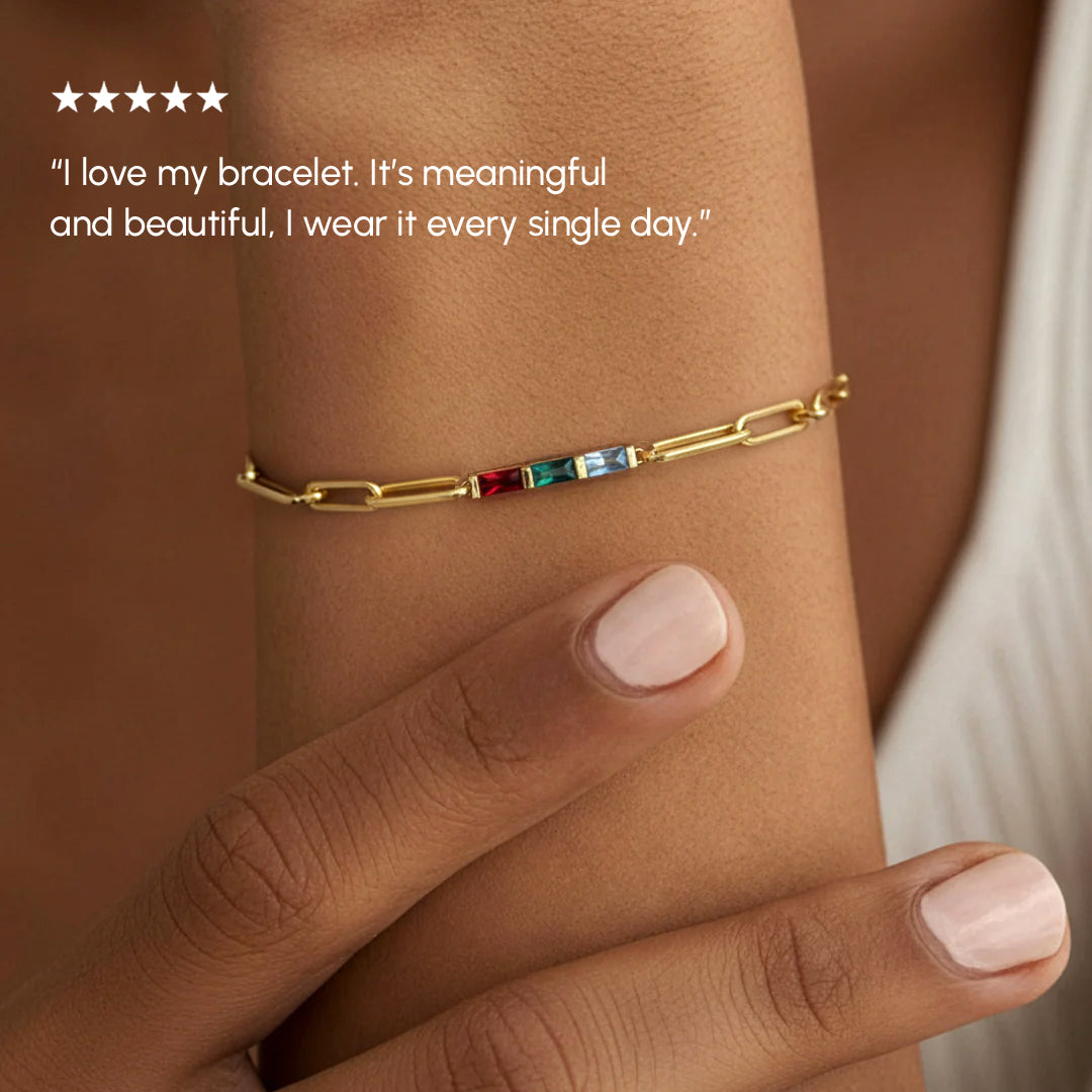 Gold bracelet with colorful stones on a wrist, with a five-star rating and customer review text.