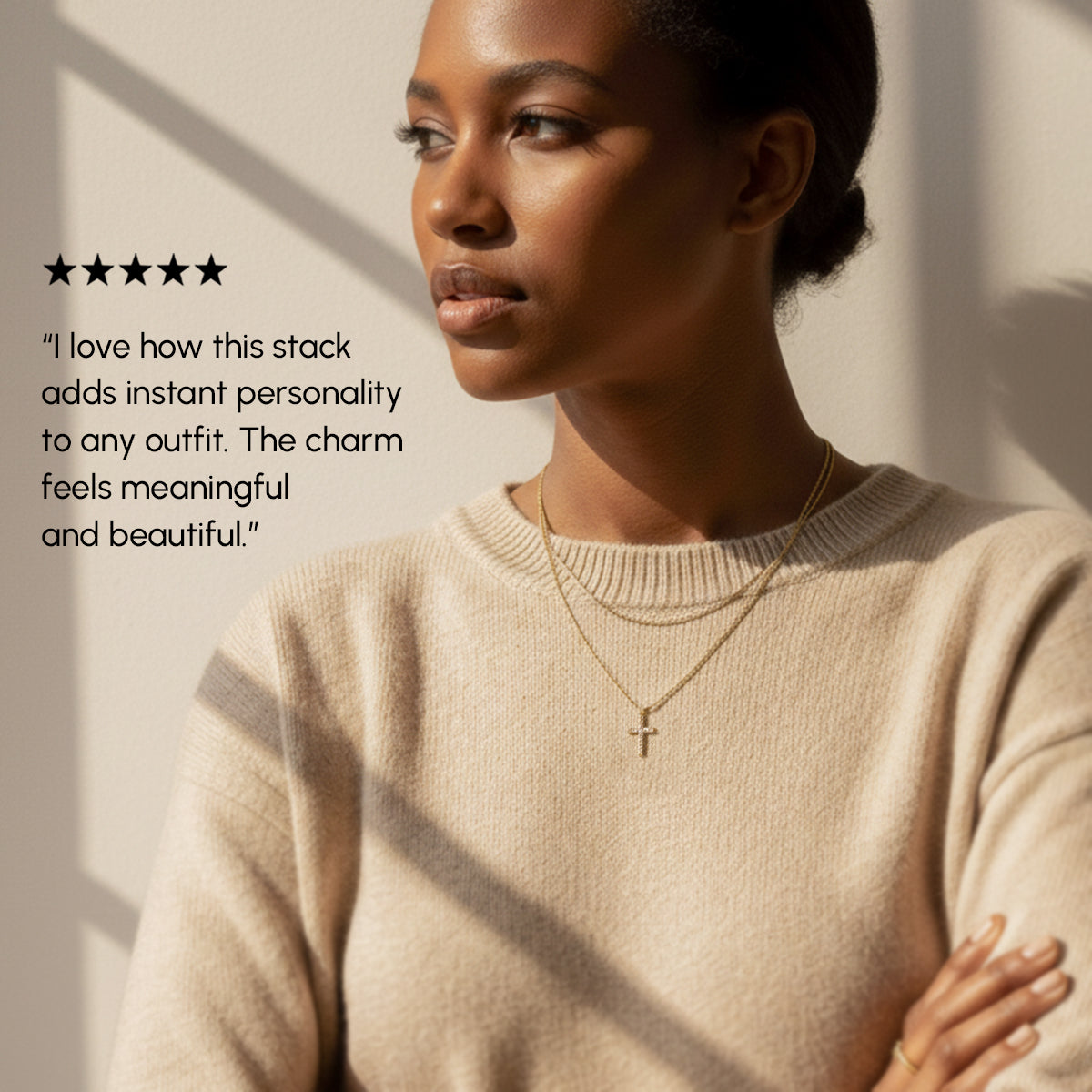 Woman wearing a beige sweater with layered necklaces, text overlay about jewelry, on a neutral background