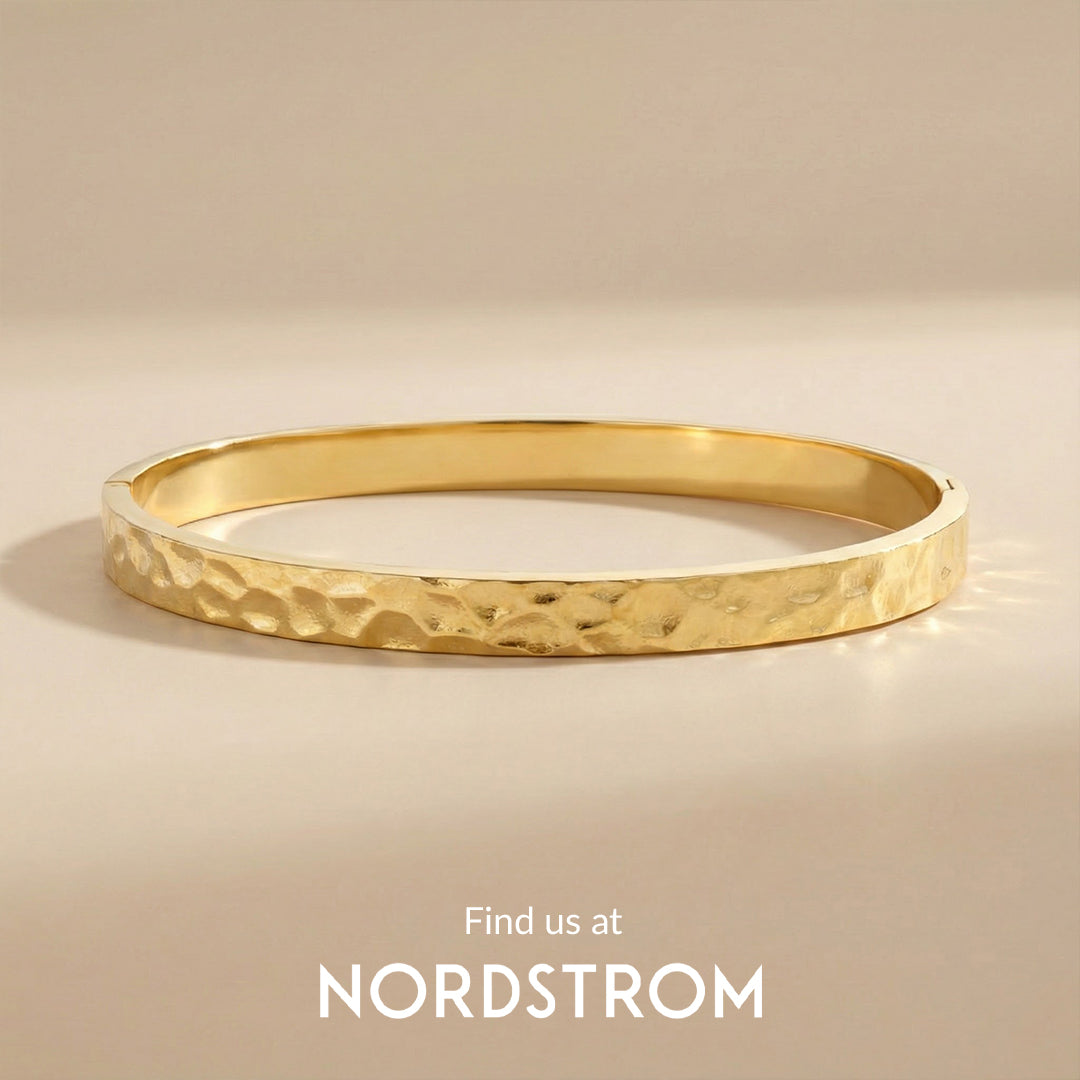 Gold bangle on a beige background with 'Nordstrom' branding.