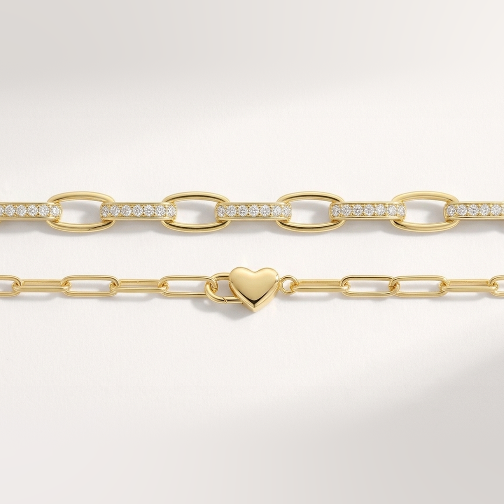 Flat lay of the gold Heart Padlock Bracelet and Interlinked Diamond Paperclip Bracelet