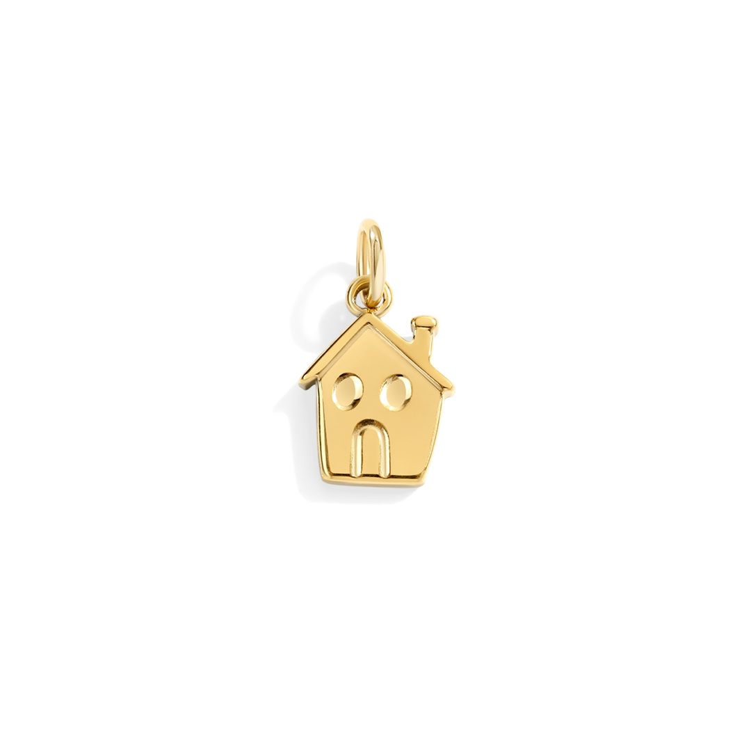 Gold house-shaped pendant on a white background