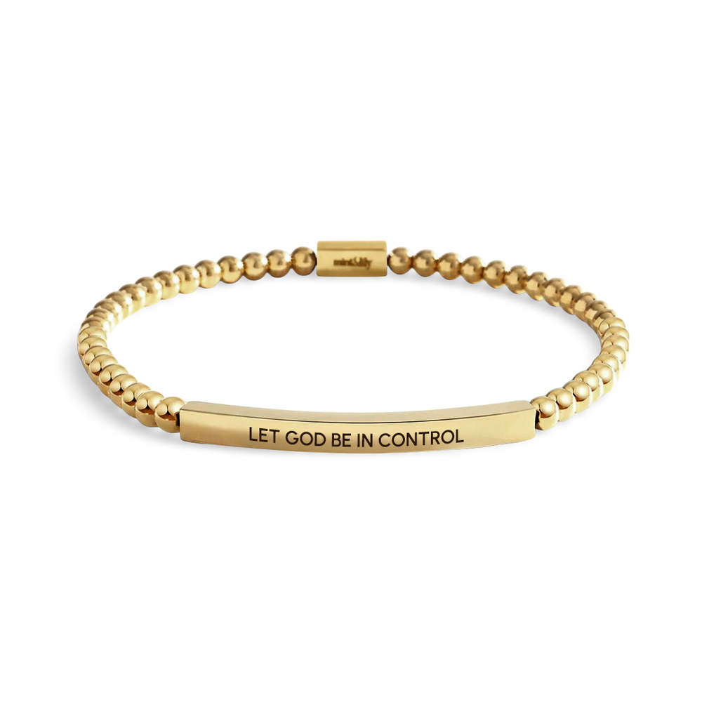 Gold bracelet with 'LET GOD BE IN CONTROL' engraving on a light background