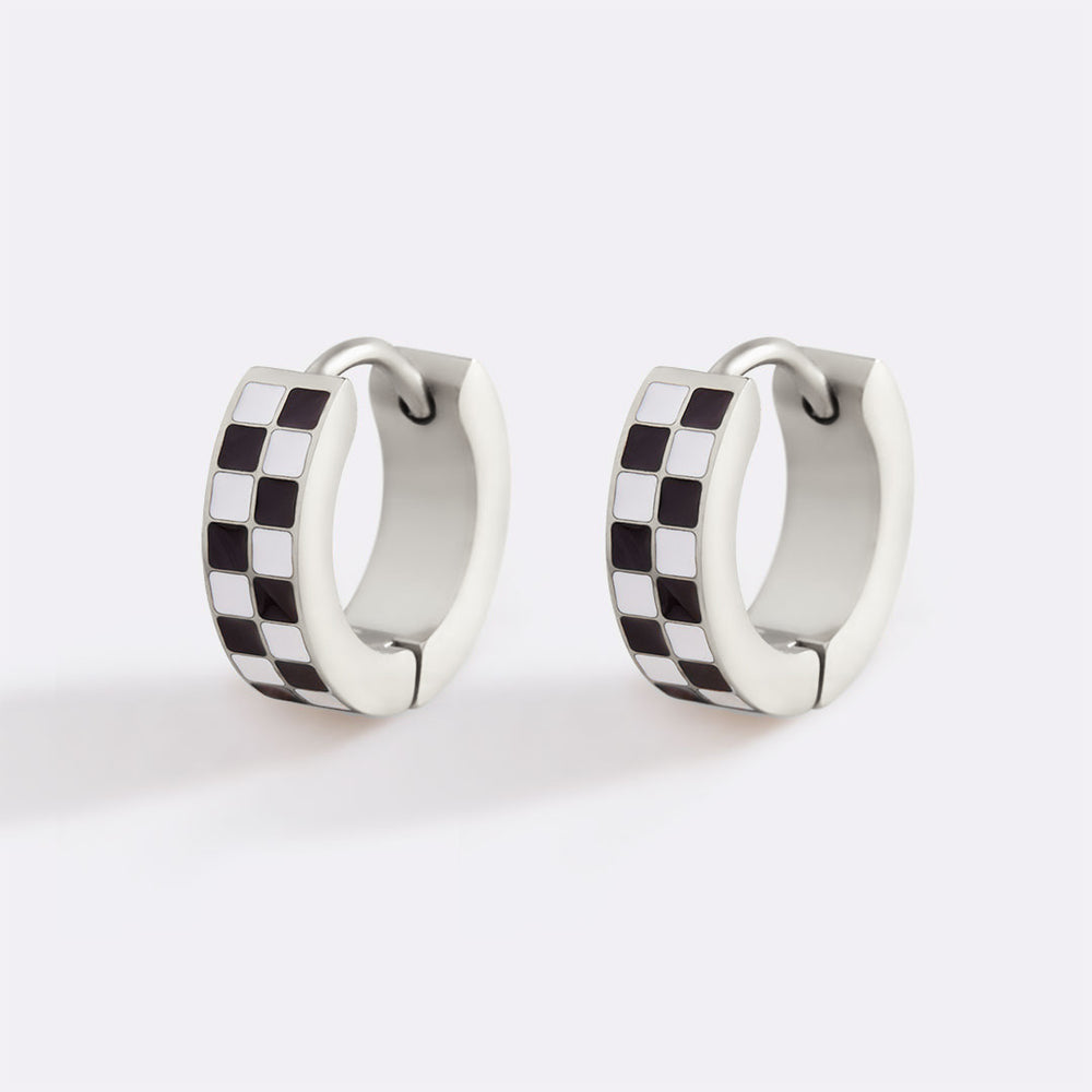 Pair of checkered hoop earrings on a white background