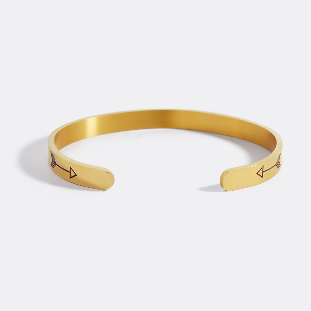 Woman wearing stacked personalized gold cuff bracelets — Mint & Lily