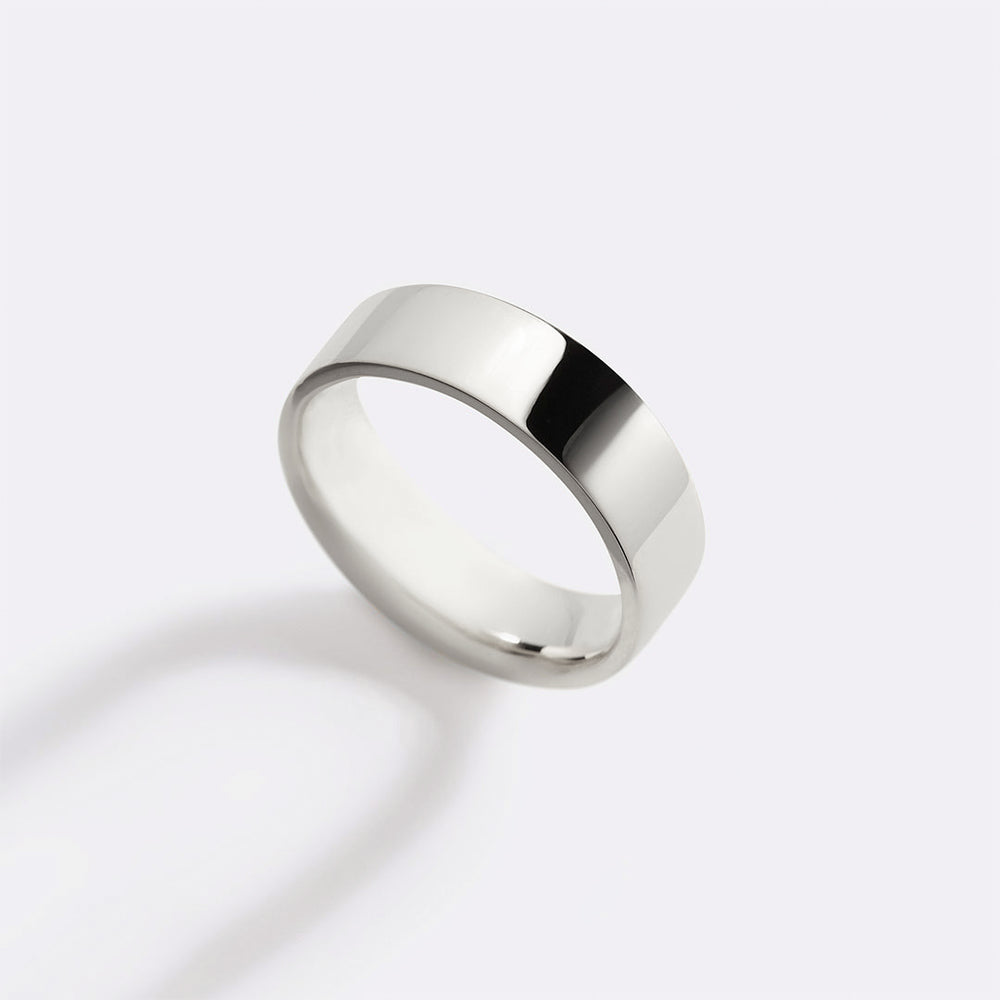 A single gold-colored metal stacking ring with a 6mm band width, displayed against a white background.