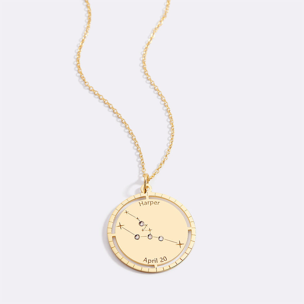 Gold necklace with a star sign pendant on a white background