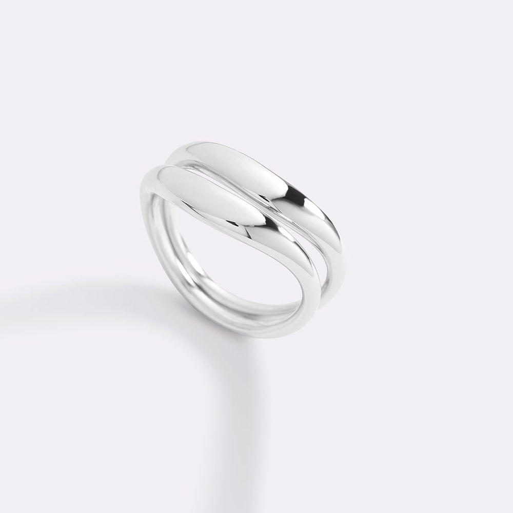 Silver ring on a light gray background