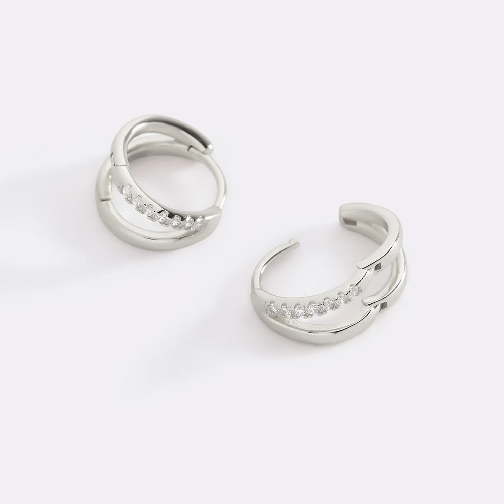 Pair of silver hoop earrings on a white background