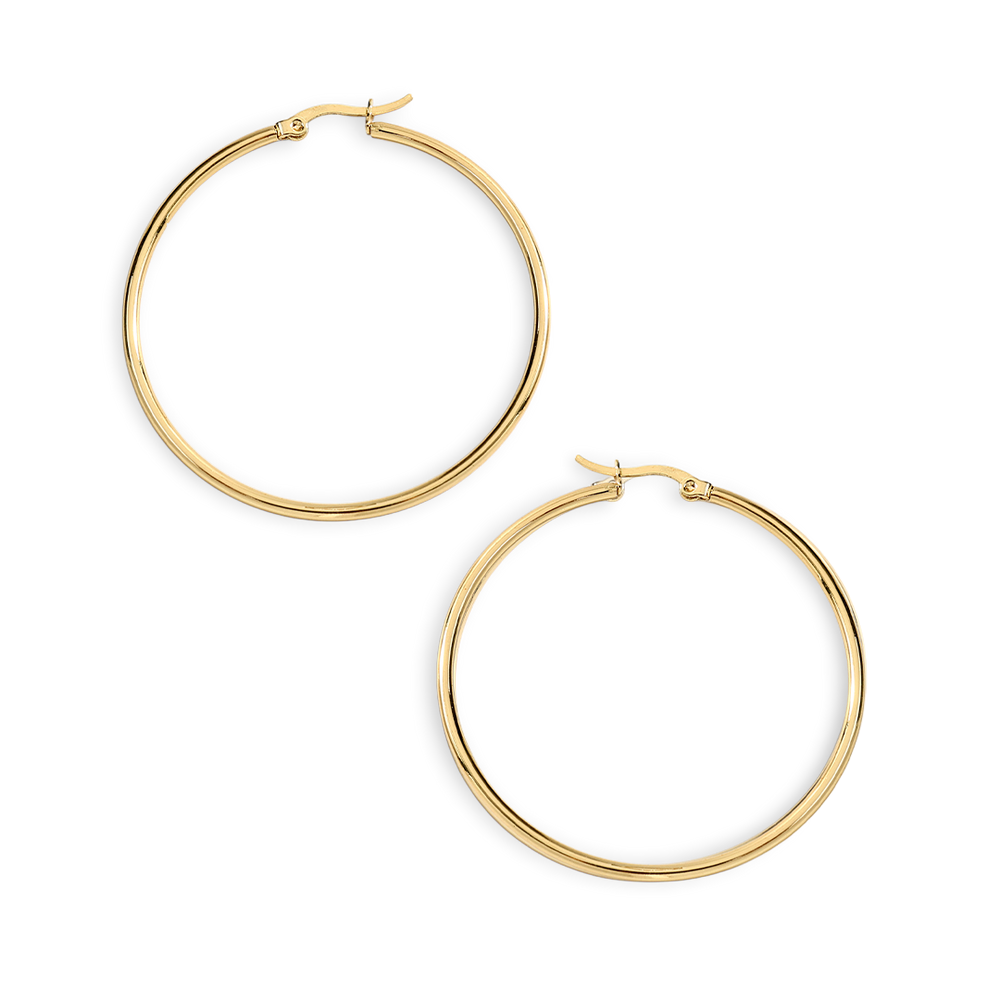 Gold hoop earrings on a light gray background