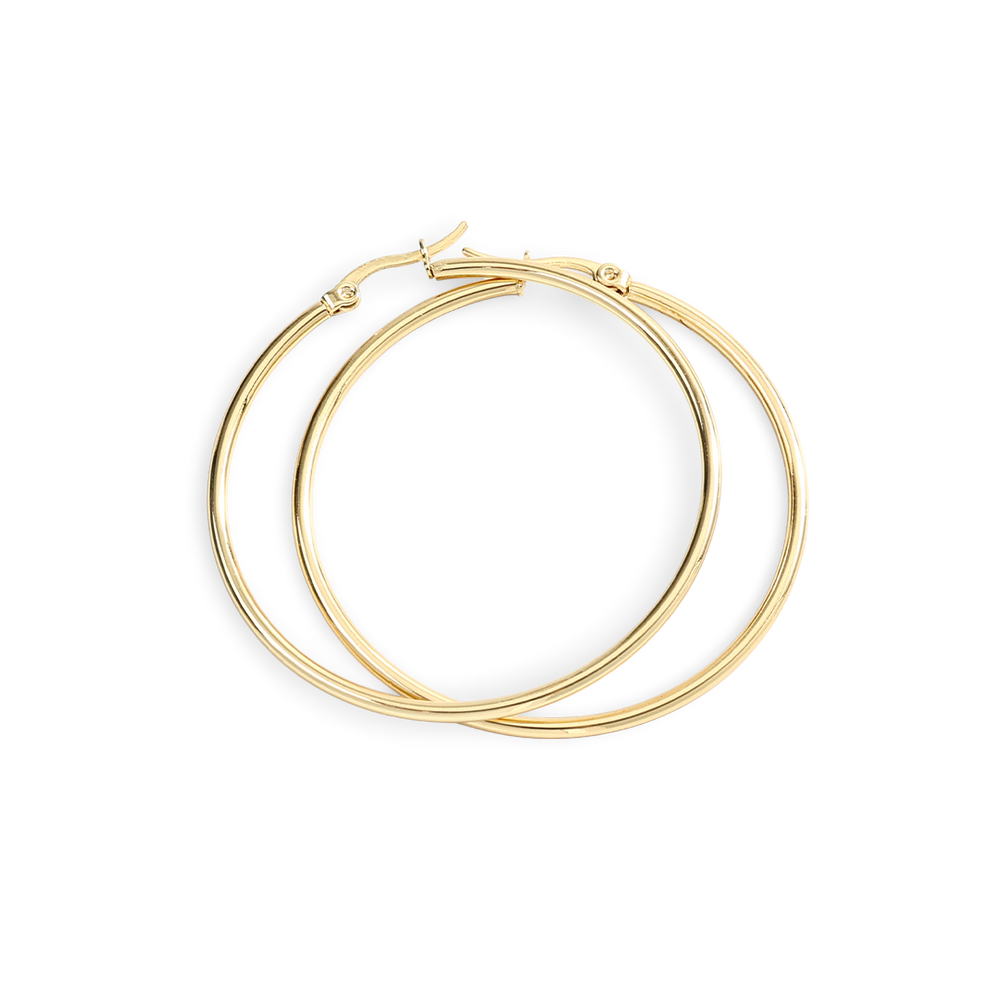 Gold hoop earrings on a light gray background