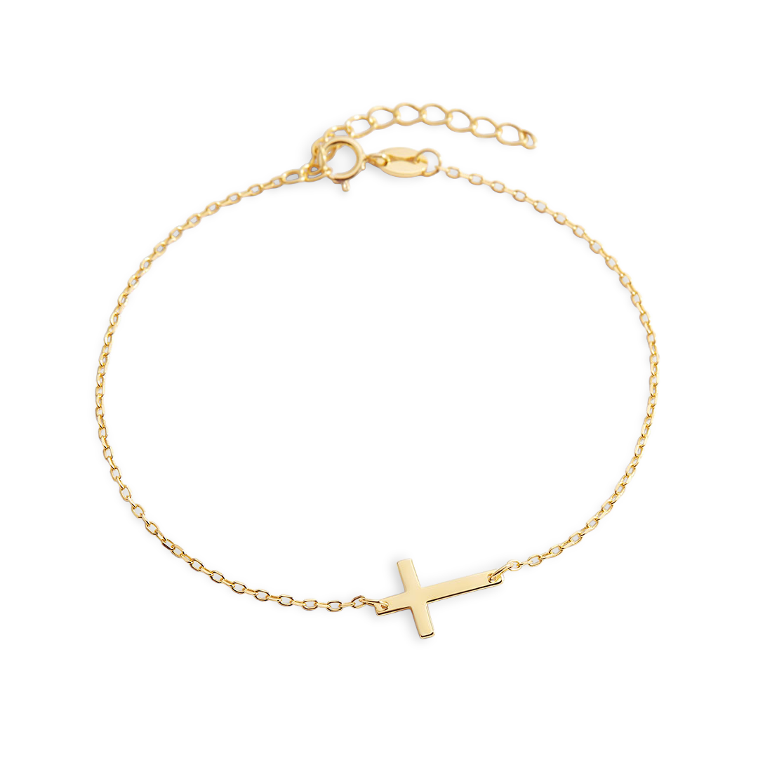 Gold bracelet with a cross charm on a white background