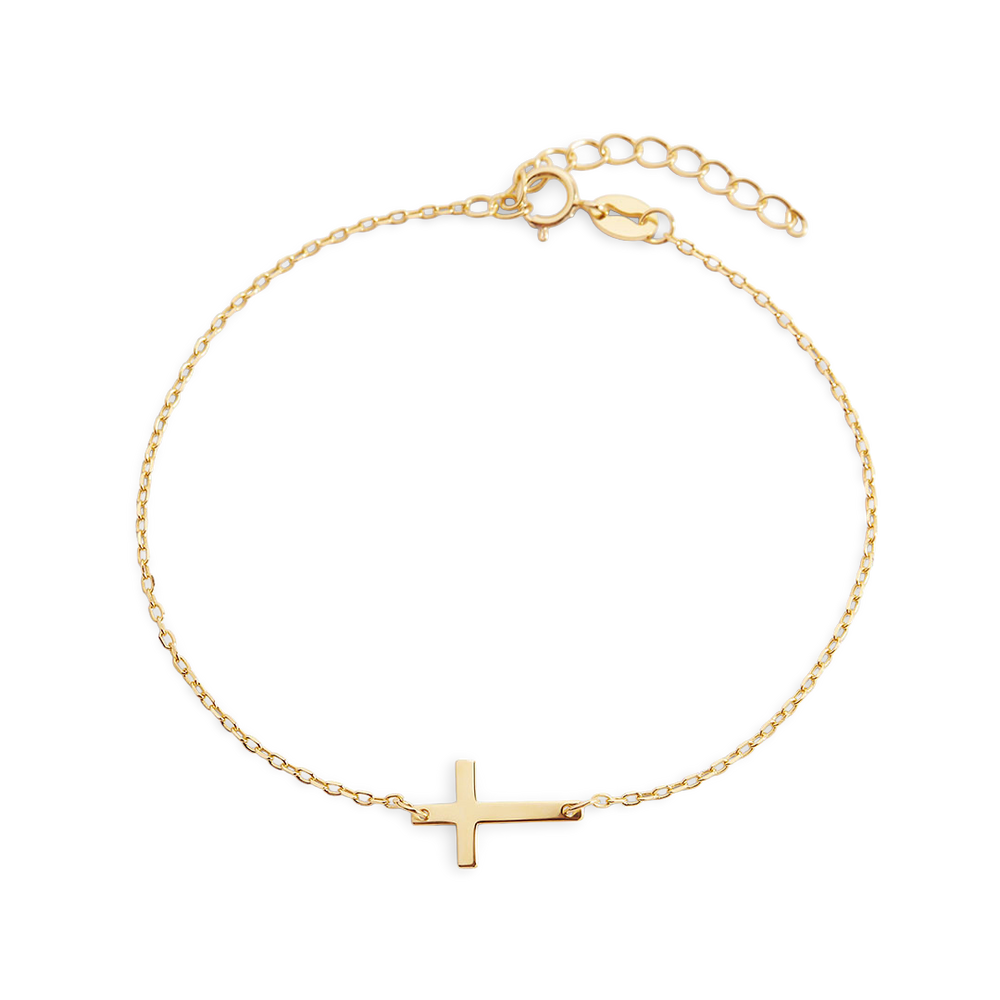Gold bracelet with a cross charm on a white background