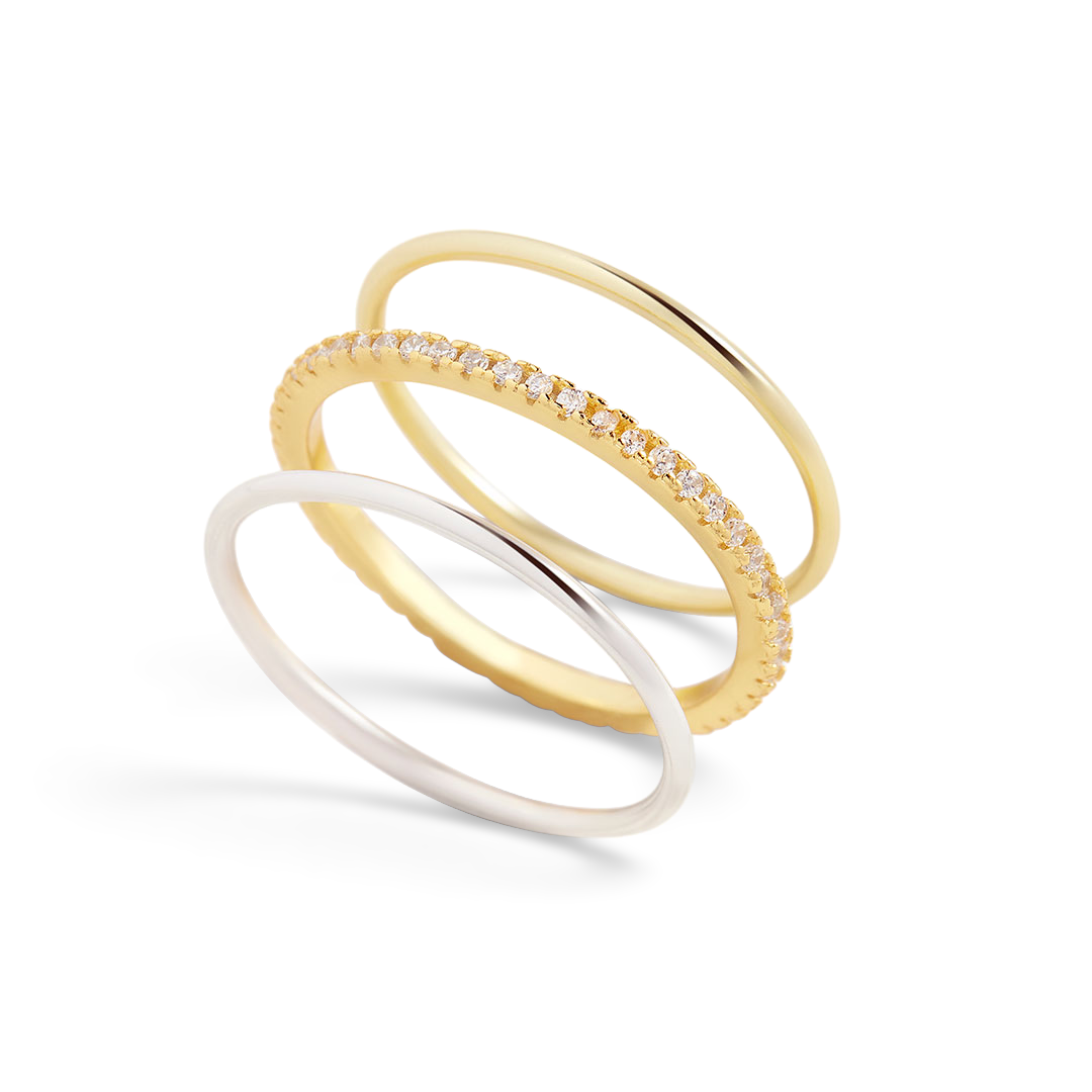 Stack of gold rings with white background