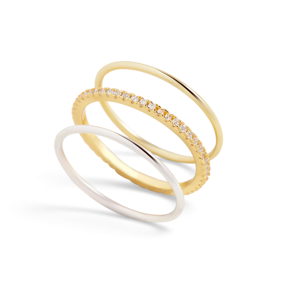 Stack of gold rings with white background