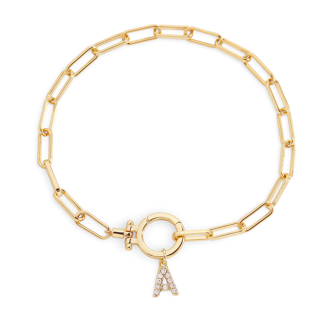 Gold chain bracelet with a charm on a white background