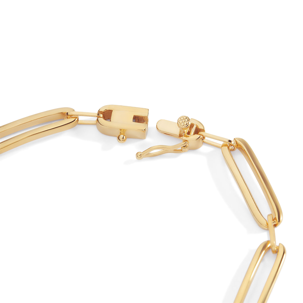 Gold bracelet with a clasp on a white background