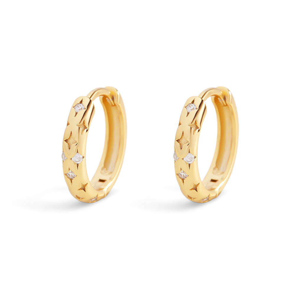 Gold hoop earrings with small diamonds on a light gray background