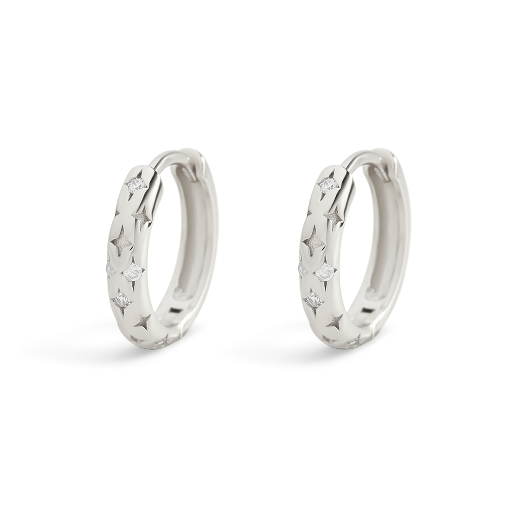 Pair of silver hoop earrings with star designs on a white background