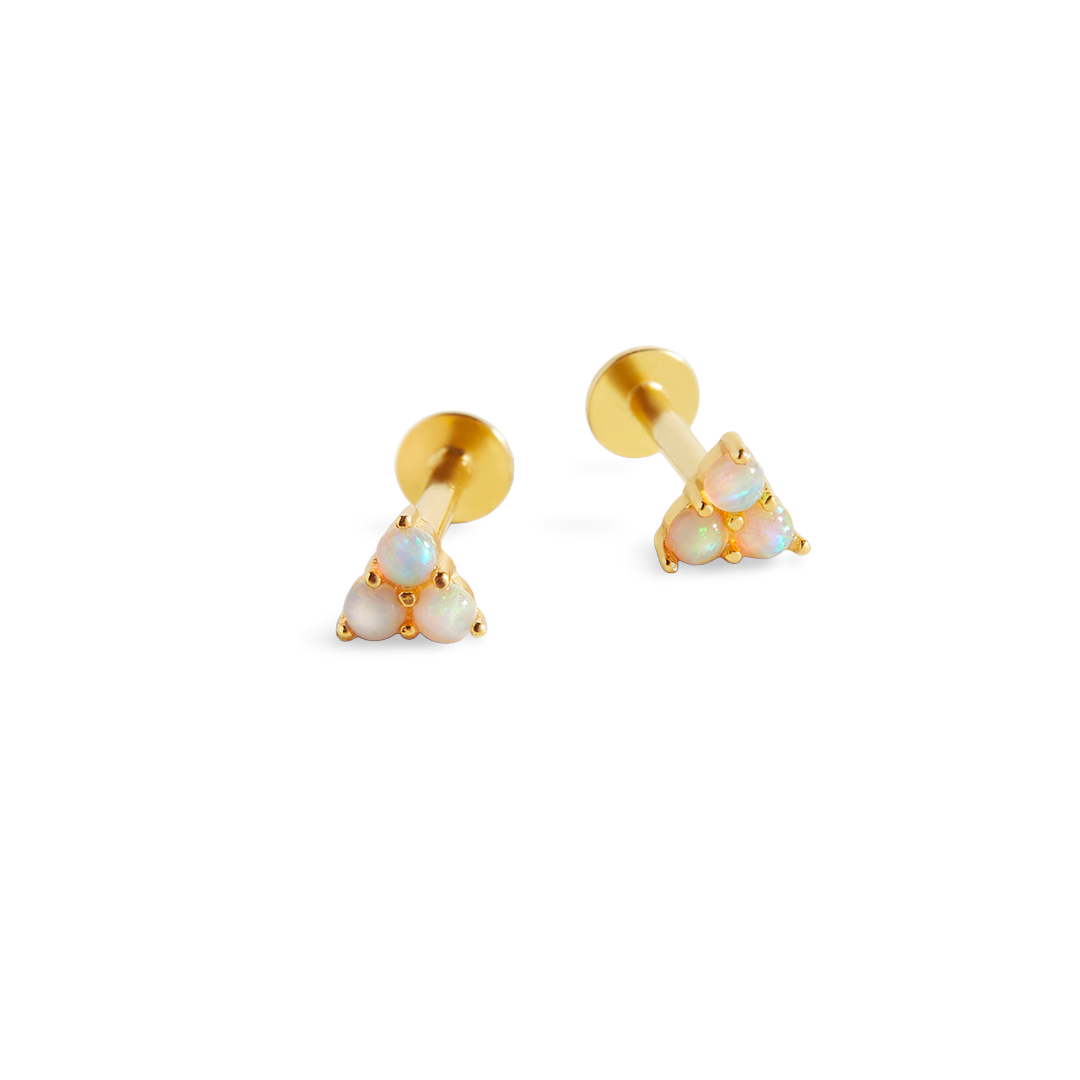 A pair of gold-colored sleeper stud earrings featuring opal stones.