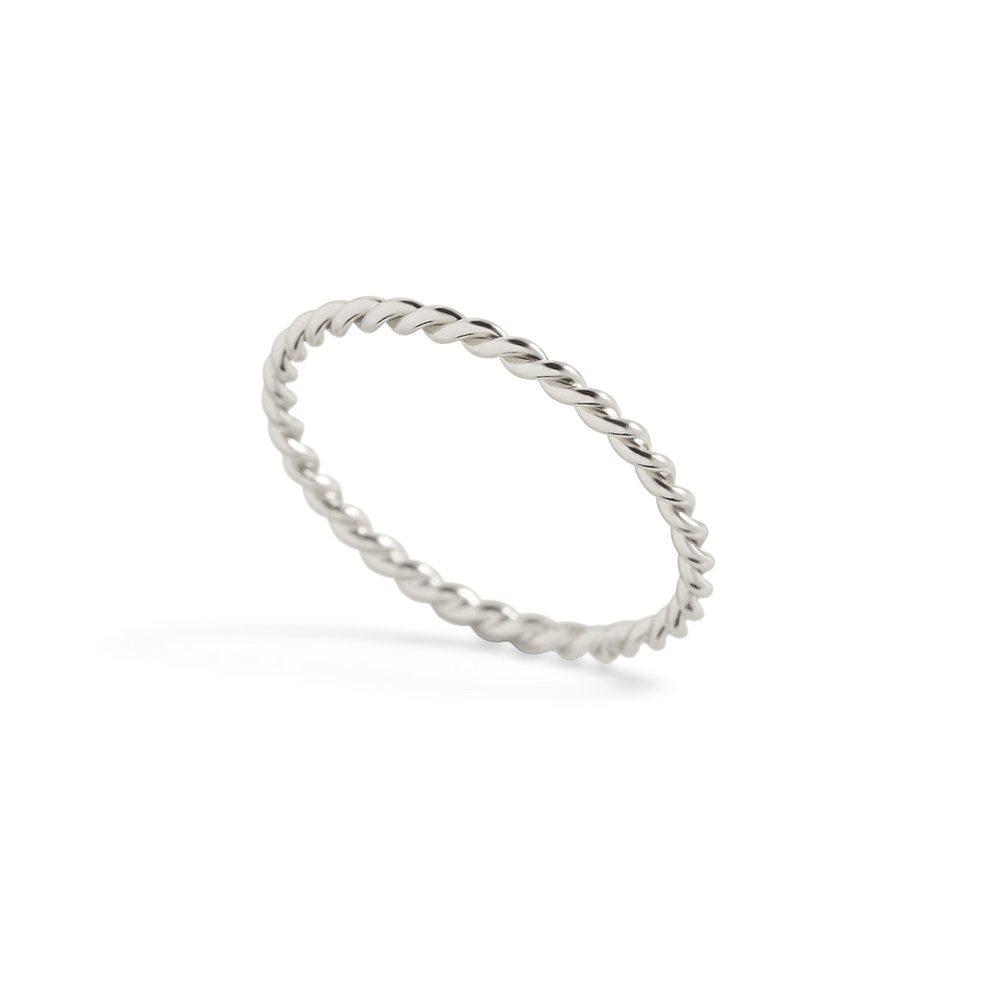 A delicate gold-colored braided ring on a black background.