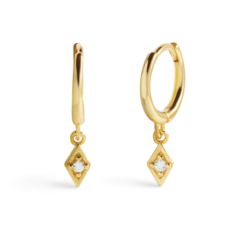 A pair of gold-colored hoop earrings with diamond charms attached to them, displayed against a black background.