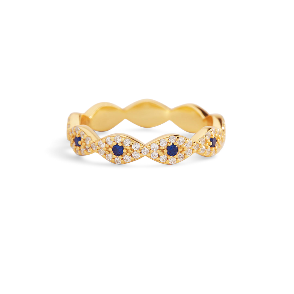 Gold ring with blue gemstones on a white background
