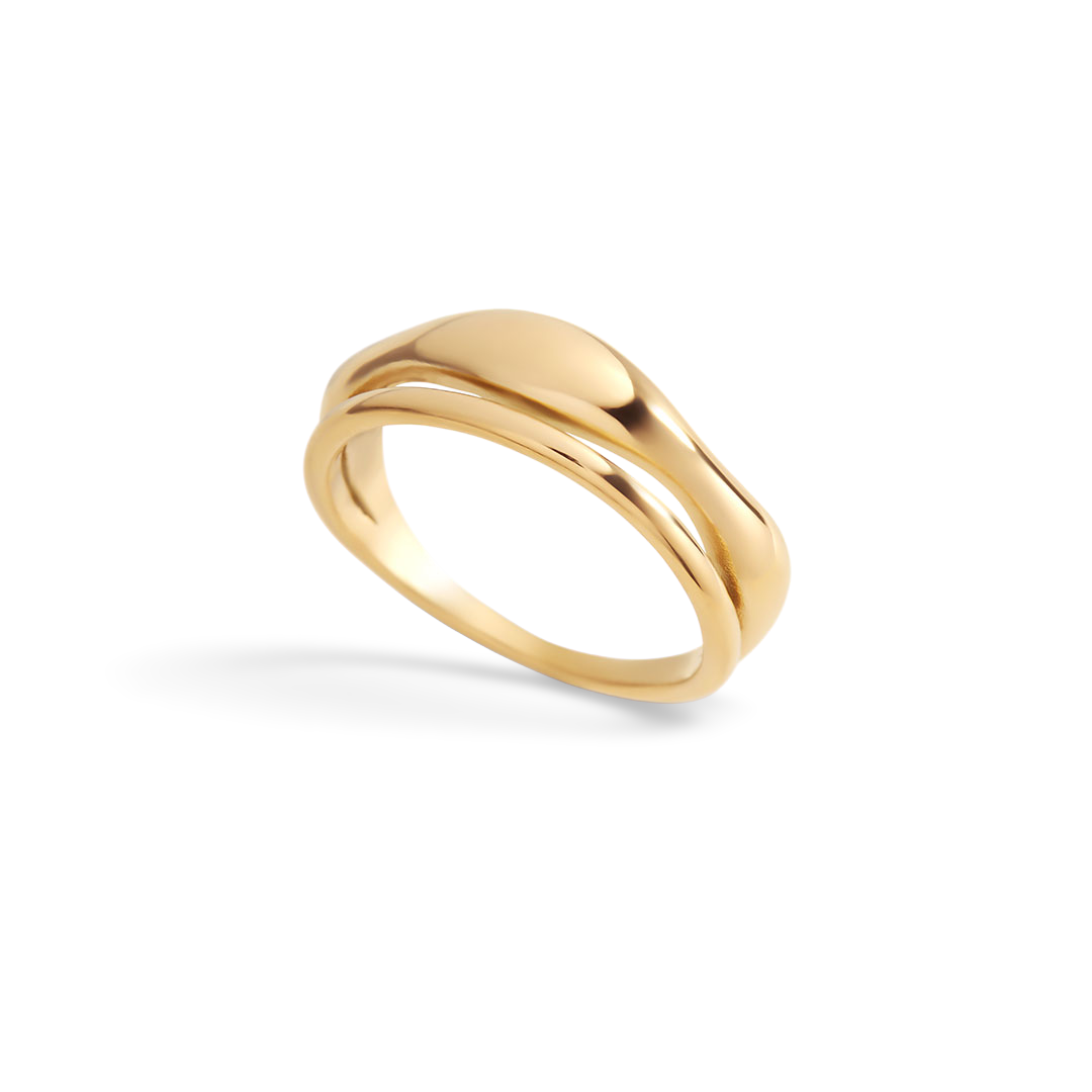 Gold ring on a light gray background