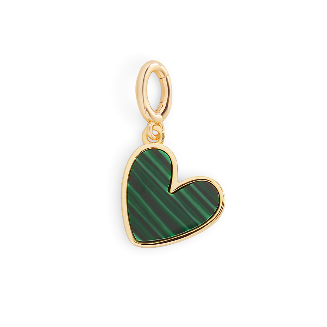 Heart-shaped pendant with green pattern and gold frame on a light gray background