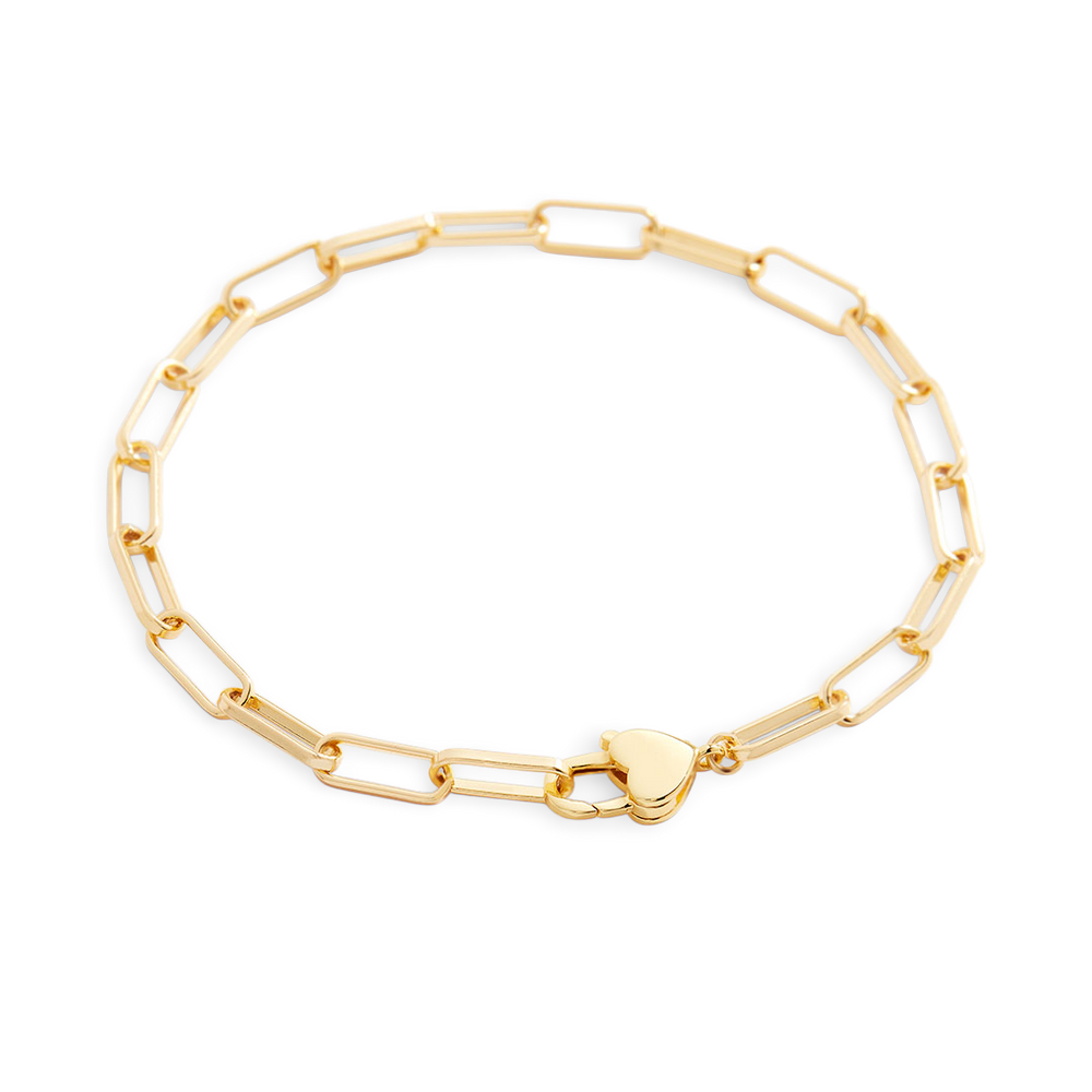 Gold chain bracelet with a heart-shaped clasp on a light gray background