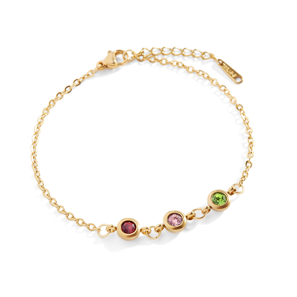 A gold-colored bracelet featuring a series of round charms with different colored gemstones in the center, connected by a dainty cable chain.