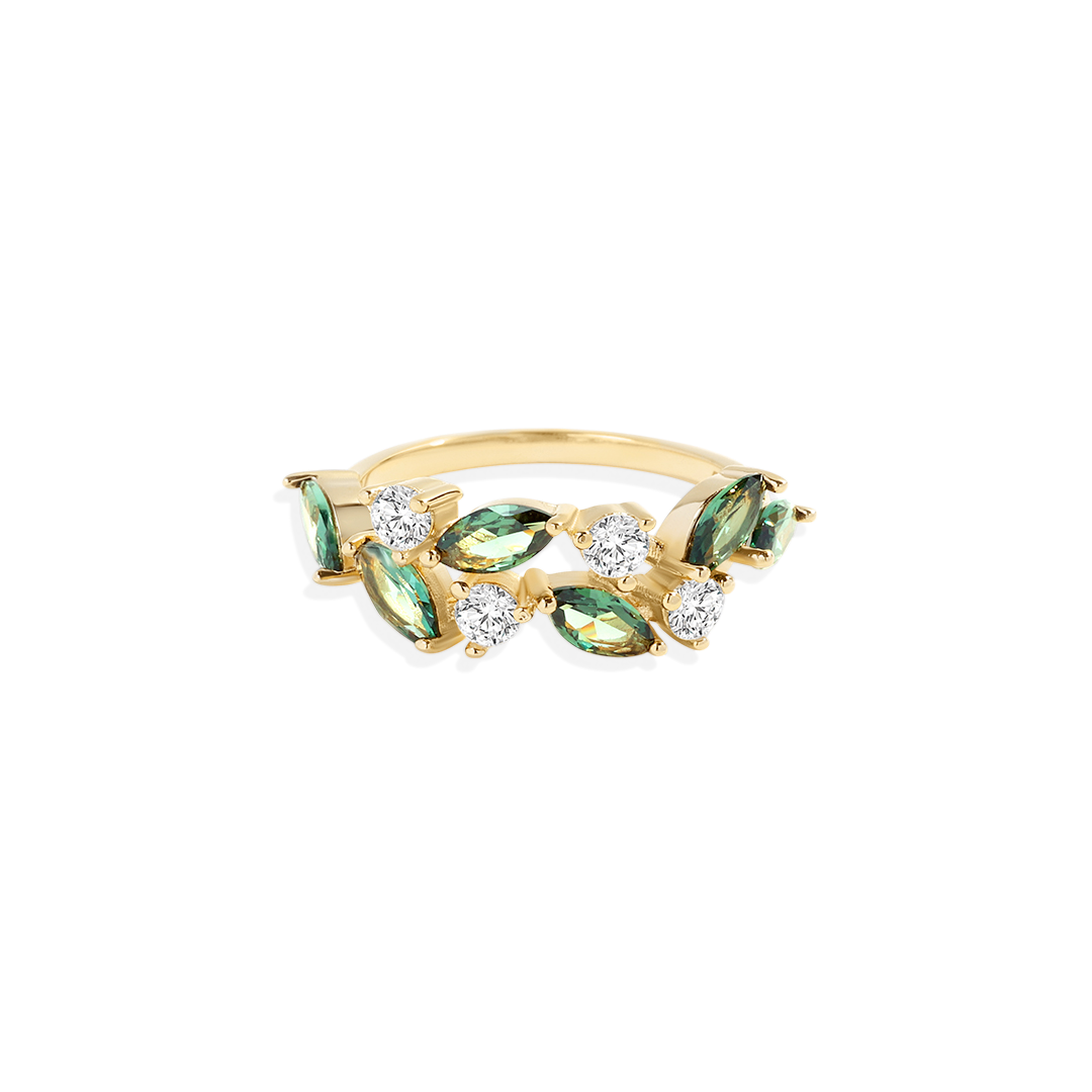 A leaf-inspired ring with green marquise stones and gold-colored metal, set against a white background.