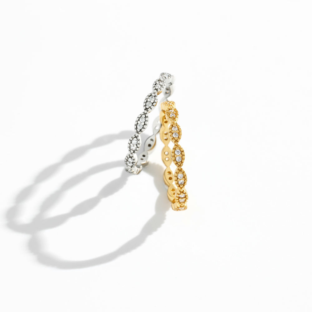 Two gold and silver rings on a white background