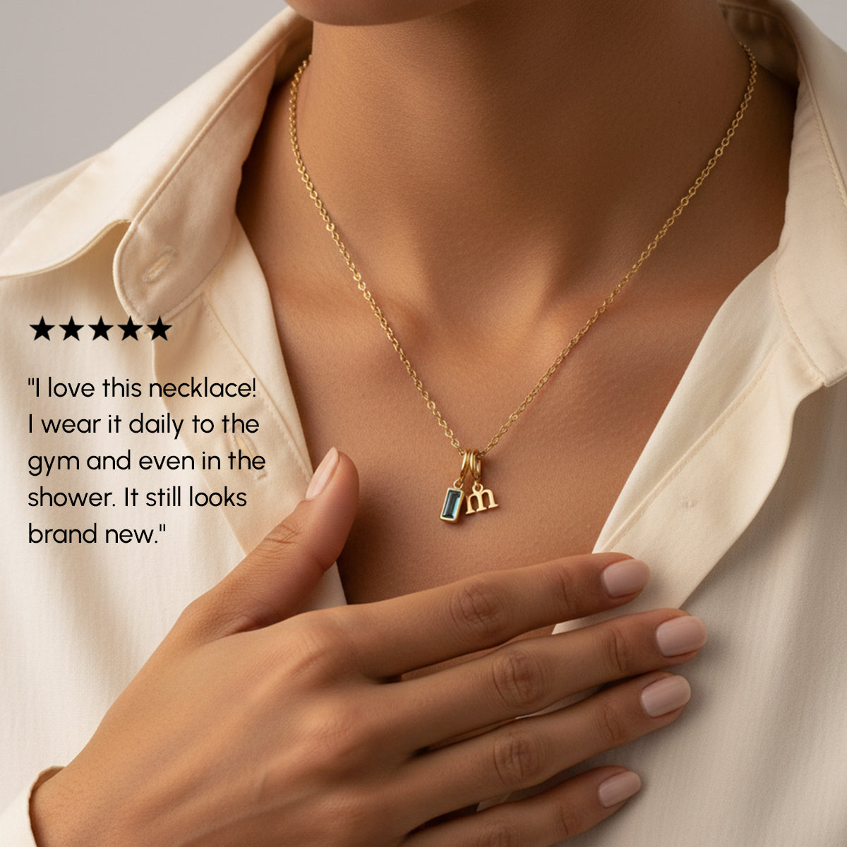 Gold necklace with charms worn by a person, with a five-star rating and customer review text.