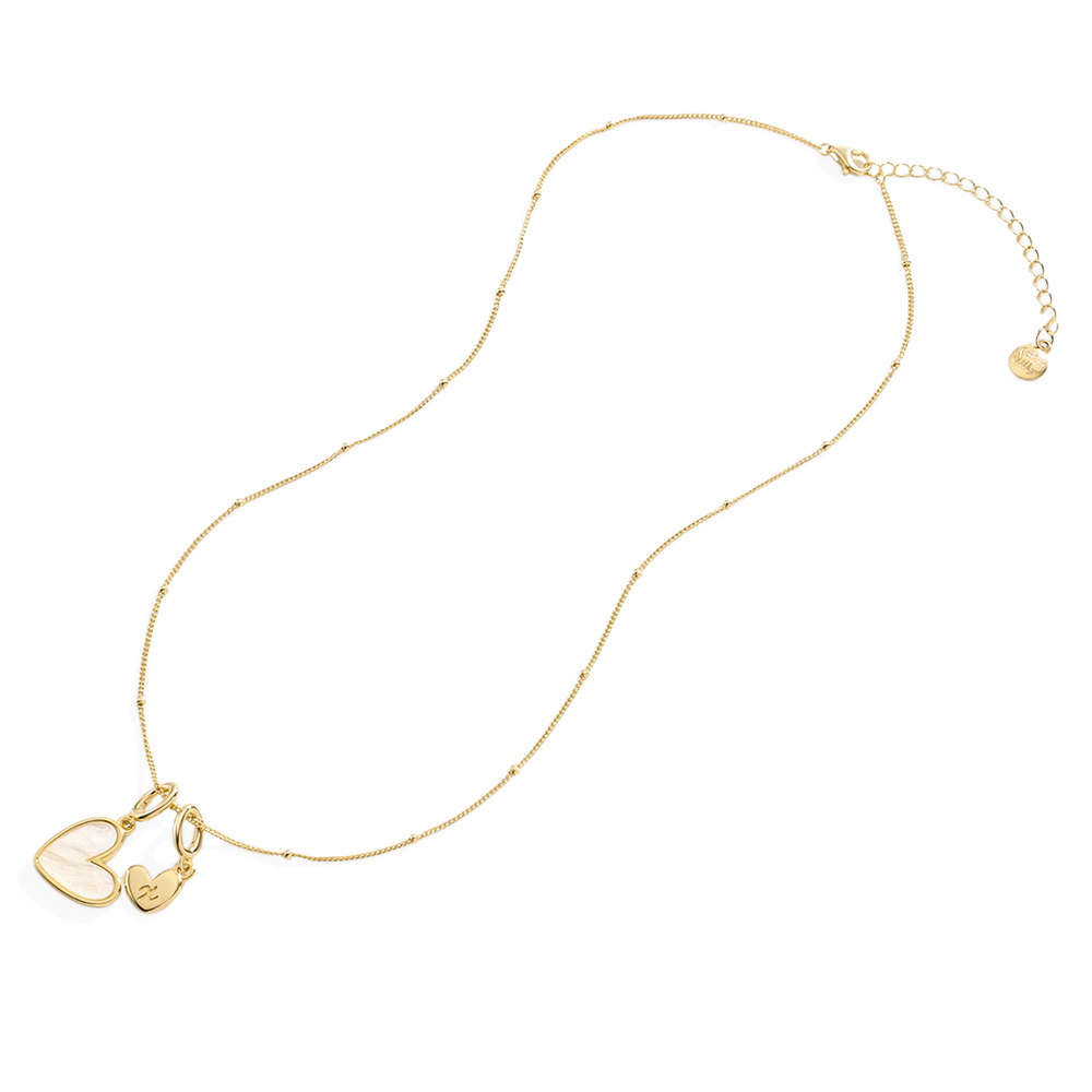 Gold necklace with heart-shaped pendants on a light gray background