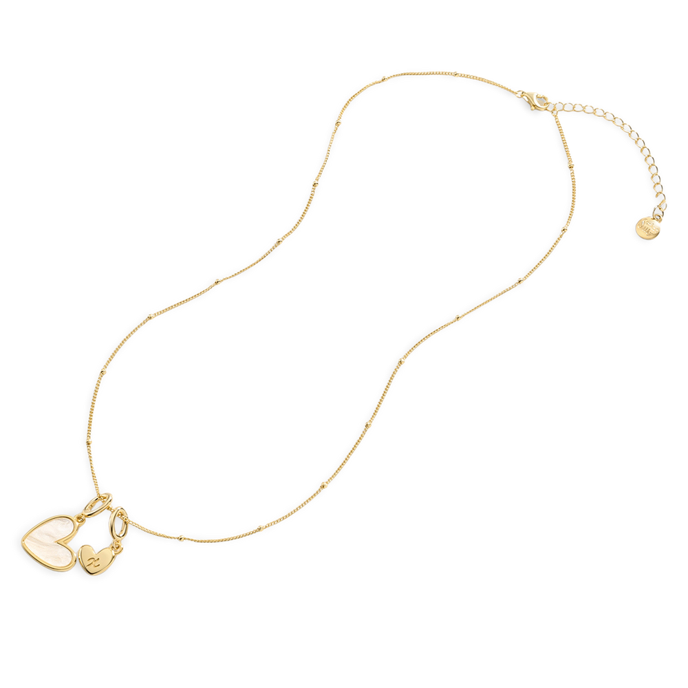 Gold necklace with heart-shaped pendants on a light gray background